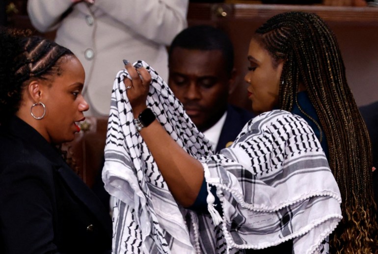 Summer Lee puts a keffiyeh on Cori Bush.