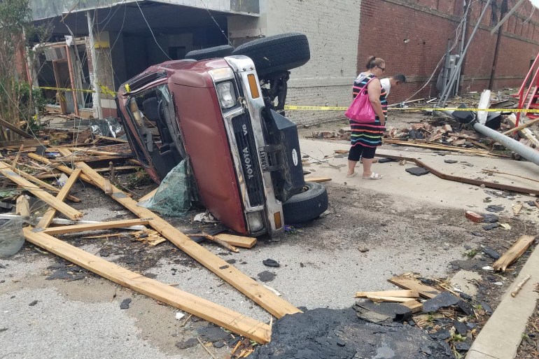 An overturned car on a Sulphur street.