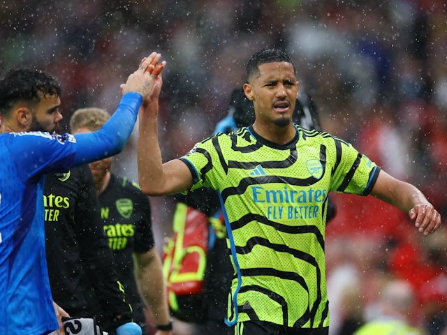 Arsenal's William Saliba and David Raya celebrate after the match on May 12, 2024