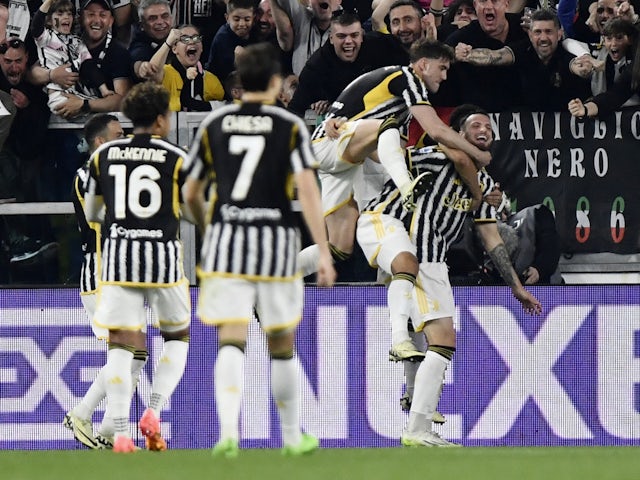 Juventus' Federico Gatti celebrates scoring their first goal with Dusan Vlahovic on April 7, 2024