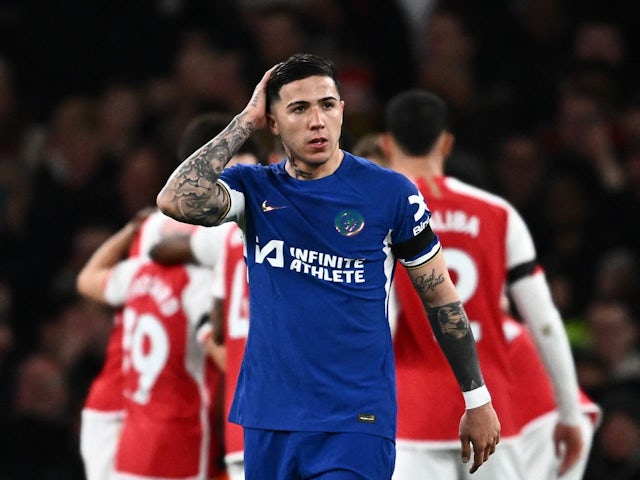 Chelsea's Enzo Fernandez looks dejected after Arsenal's Kai Havertz scores their fourth goal on April 23, 2024