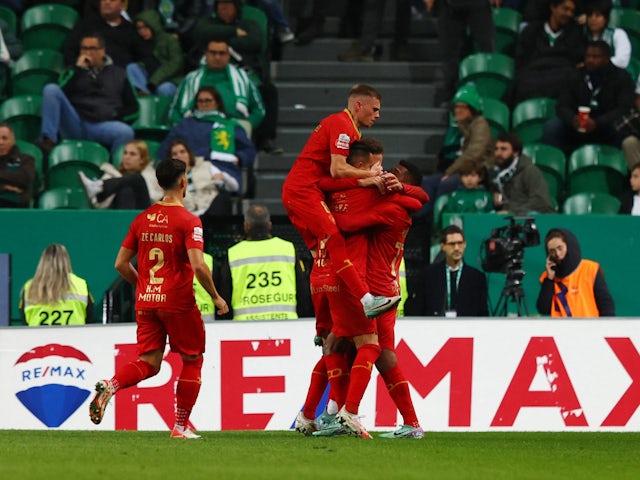 Gil Vicente's Ruben Fernandes celebrates scoring their first goal with teammates on December 4, 2023