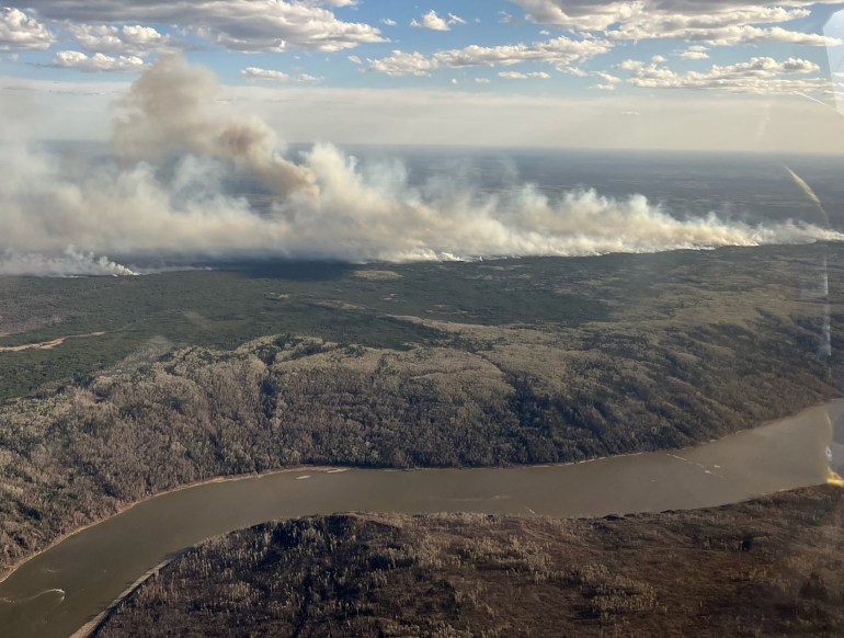 Smoke rises from a wildfire near Fort McMurray, Alberta, Canada