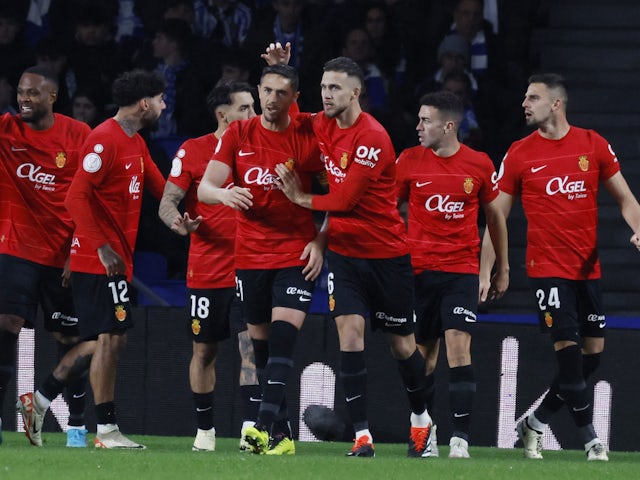 Mallorca's Giovanni Gonzalez celebrates scoring their first goal with Jose Manuel Copete on February 27, 2024