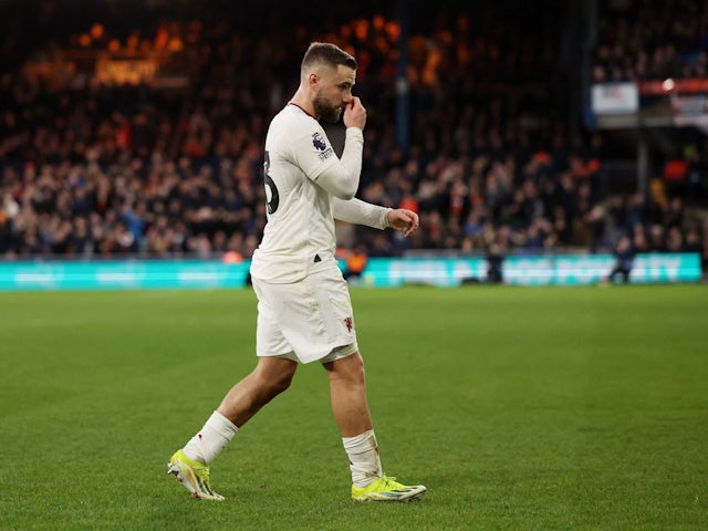 Manchester United's Luke Shaw walks off the pitch to be substituted due to injury on February 18, 2024