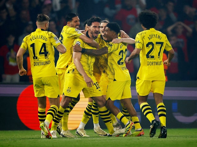 Borussia Dortmund's Mats Hummels celebrates scoring their first goal with teammates on May 7, 2024
