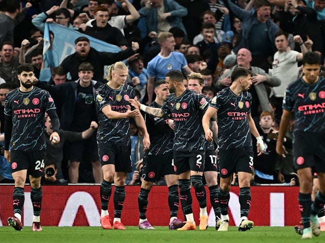 Manchester City's Erling Haaland celebrates scoring their first goal with Kyle Walker on May 14, 2024