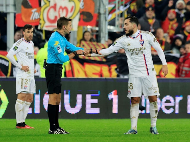 Lyon' Rayan Cherki with referee Clement Turpin on December 2, 2023
