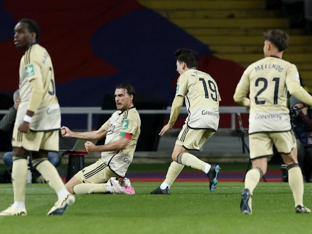 Granada's Ignasi Miquel celebrates scoring their third goal with teammates on February 11, 2024