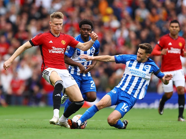 Manchester United's Scott McTominay in action with Brighton & Hove Albion's Adam Lallana on September 16, 2023