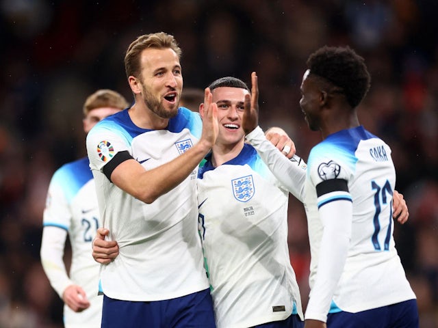 England's Harry Kane celebrates scoring their second goal with Bukayo Saka and Phil Foden on November 17, 2023