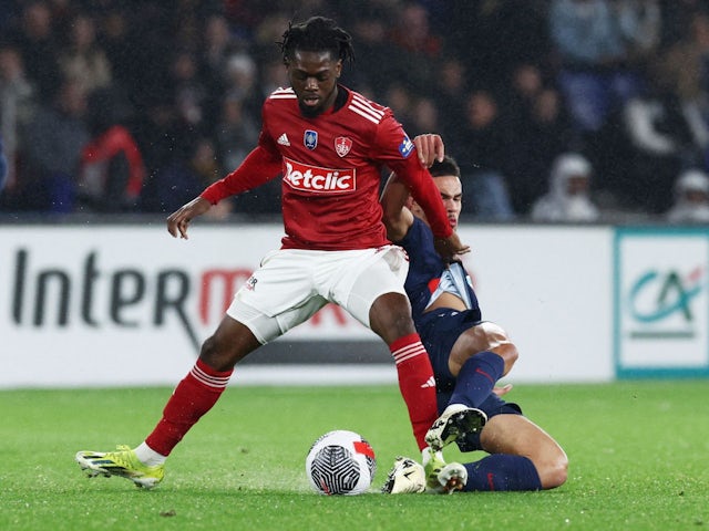 Brest's Bradley Locko in action with Paris Saint-Germain's Warren Zaire-Emery on February 7, 2024