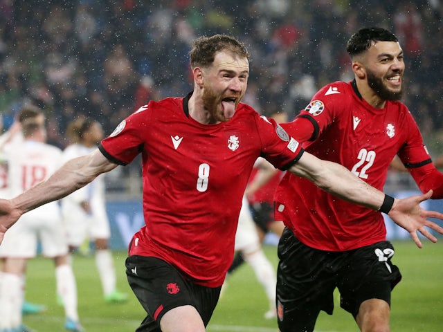Georgia's Budu Zivzivadze celebrates scoring their first goal on March 21, 2024