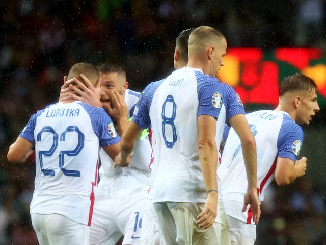Slovakia's Stanislav Lobotka celebrates scoring their second goal with Milan Skriniar on October 13, 2023