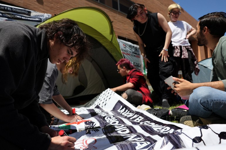 Students of the Complutense University of Madrid make banners after setting up a pro-Palestinian encampment amid the ongoing conflict between Israel and the Palestinian Islamist group Hamas, in Madrid, Spain, May 7, 2024. REUTERS/Violeta Santos Moura