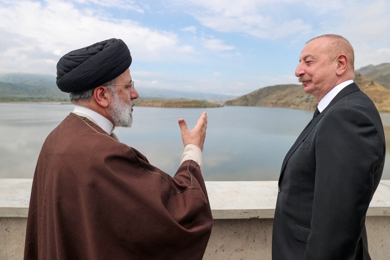 Iranian President Ebrahim Raisi and Azerbaijan's President Ilham Aliyev visit the Qiz-Qalasi dam on the Azerbaijan-Iran border,