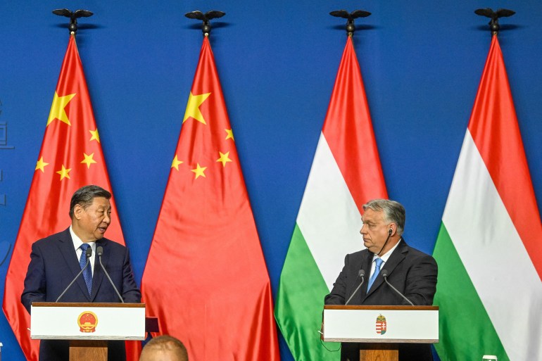 Chinese President Xi Jinping (L) and Hungarian Prime Minister Viktor Orban (R) address a statement after their official talks in Carmelita Monastery, the prime minister's headquarter, at Buda Castle quarter in Budapest,