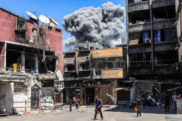 A smoke plume rises during Israeli bombardment in Jabalia in the northern Gaza Strip