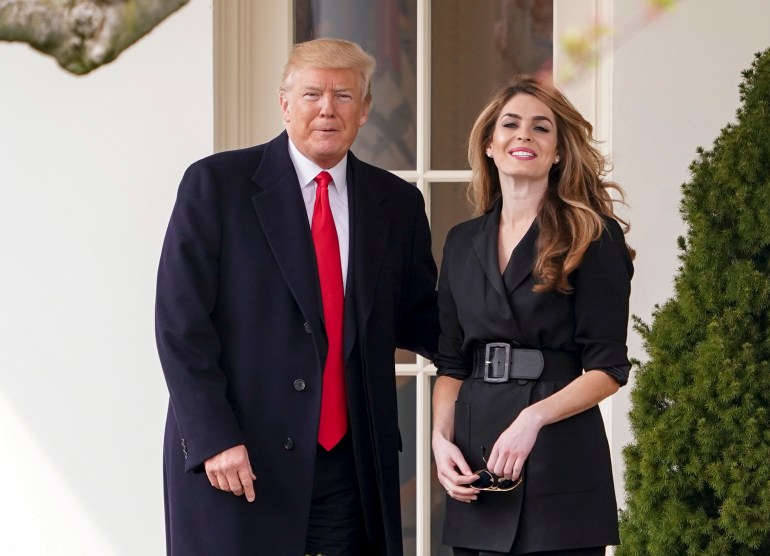 Donald Trump stands with Hope Hicks outside of the White House.