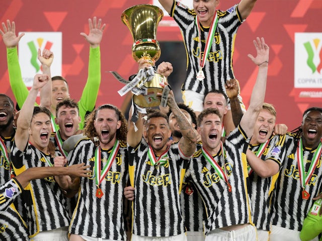 Juventus' Danilo lifts the trophy with teammates after winning the Coppa Italia final on May 15, 2024