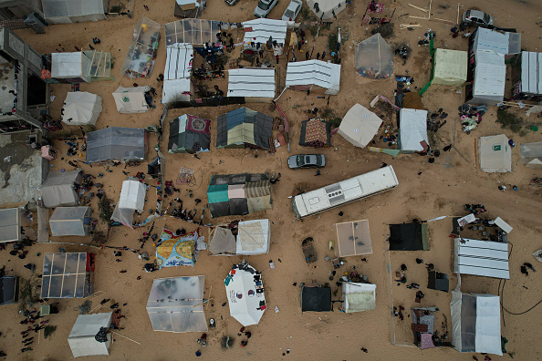 Displaced Palestinian families live in tents in the Al-Mawasi area of Rafah, situated south of the Gaza Strip and near the border with Egypt, on December 7, 2023.