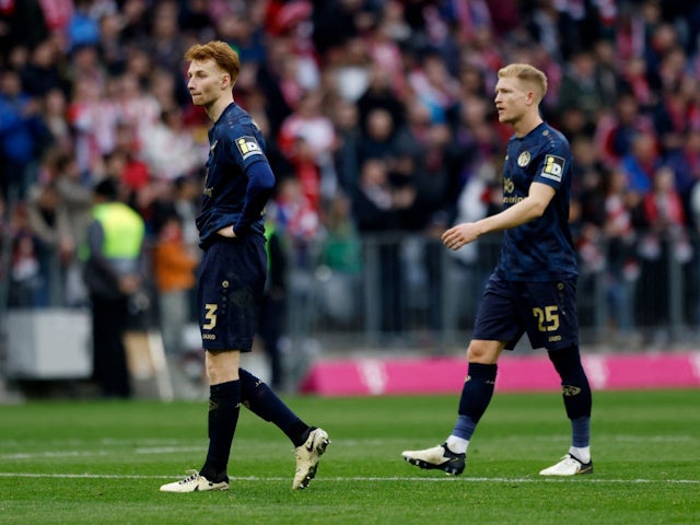 Mainz 05's Sepp van den Berg and Andreas Hanche-Olsen look dejected after the match on March 9, 2024