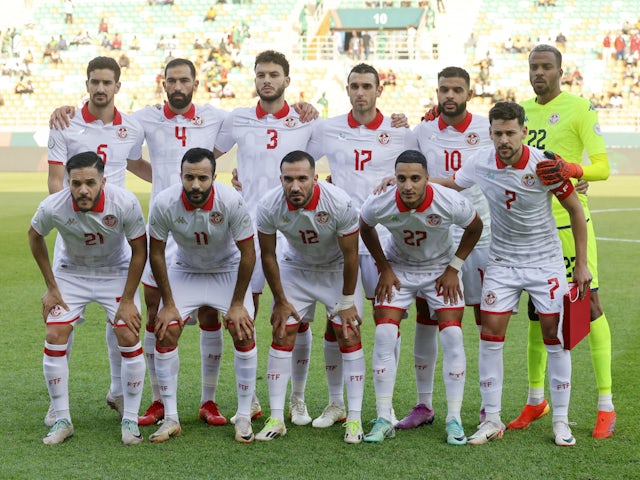 Tunisia players pose for a team group photo before the match on January 16, 2024