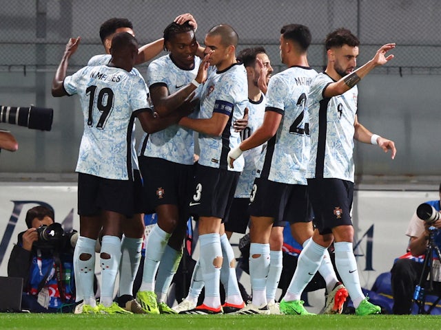 Portugal's Rafael Leao celebrates scoring their first goal with teammates on March 21, 2024