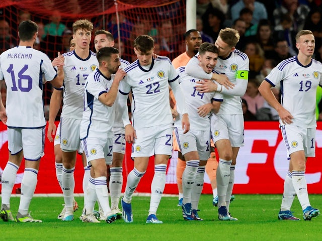 Scotland's Billy Gilmour celebrates scoring their first goal with teammates on October 17, 2023