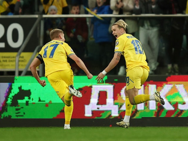 Ukraine's Mykhaylo Mudryk celebrates scoring their second goal with Oleksandr Zinchenko on March 26, 2024