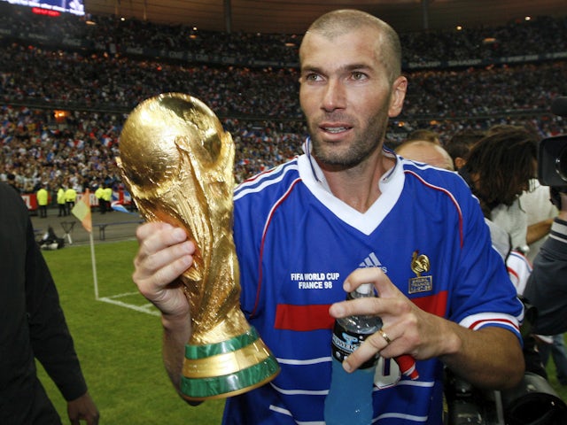 Zinedine Zidane pictured with the World Cup trophy in 1998