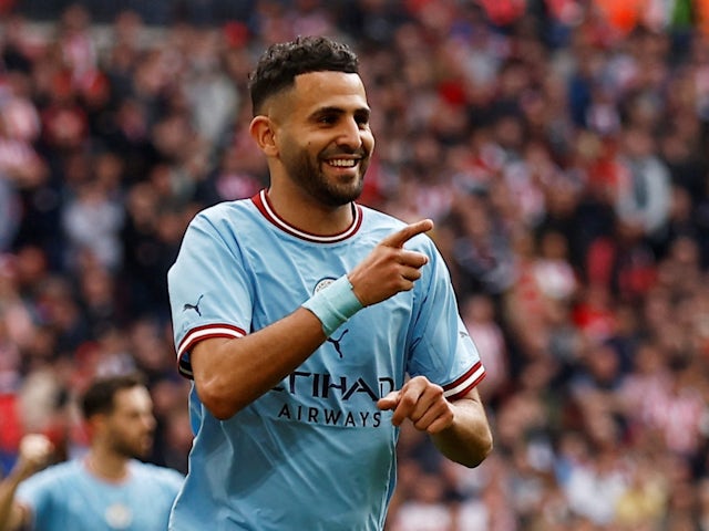 Manchester City's Riyad Mahrez celebrates scoring their third goal on April 22, 2023