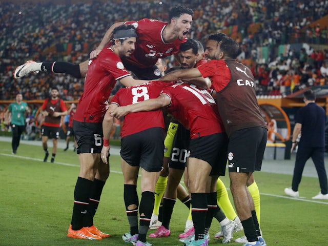 Egypt's Mostafa Mohamed celebrates scoring their second goal with teammates on January 19, 2024