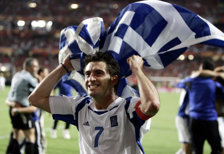Football player carrying flag.