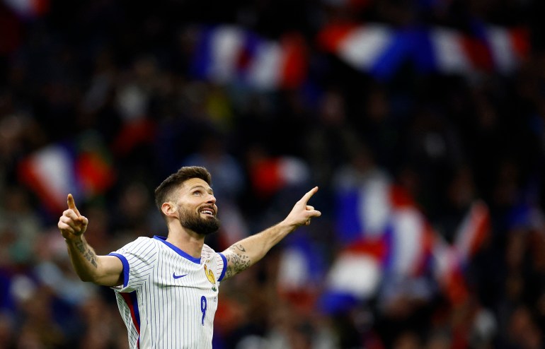 Football player celebrates with crowd.