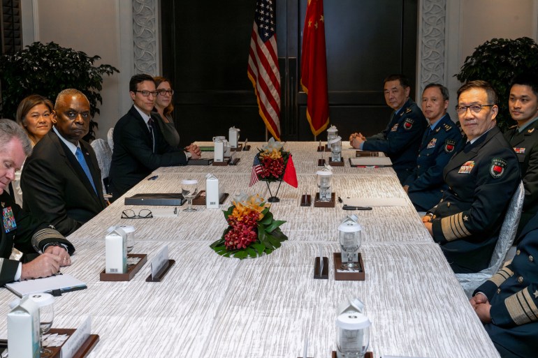 Chinese Defence Minister Dong Jun, right, and US Secretary of Defense Lloyd Austin at a meeting in Singapore