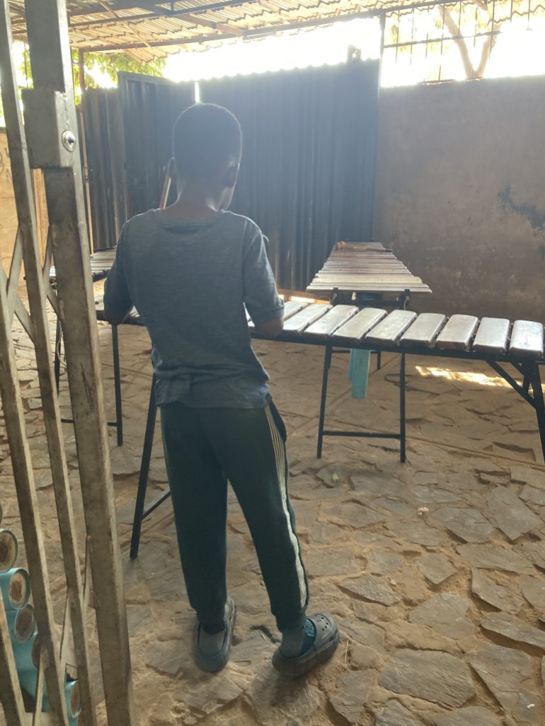 A child plays a marimba