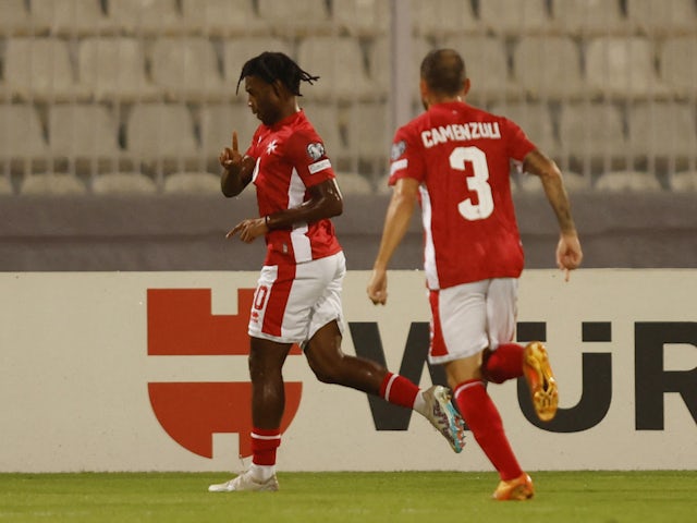 Malta's Paul Mbong celebrates scoring their first goal with Ryan Camenzuli on October 17, 2023