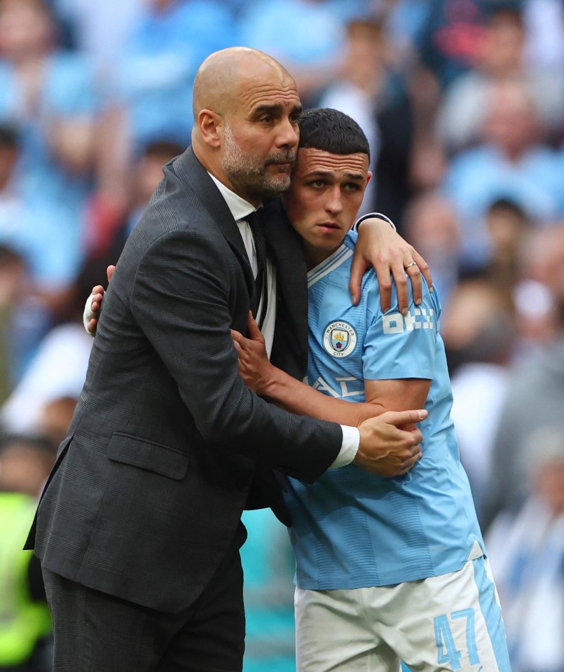 Guardiola comforts Phil Foden after the FA Cup final
