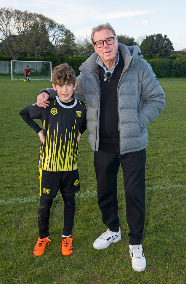 Harry with young Milford footballer Jack Gunner after joining kids on the pitch in April this year