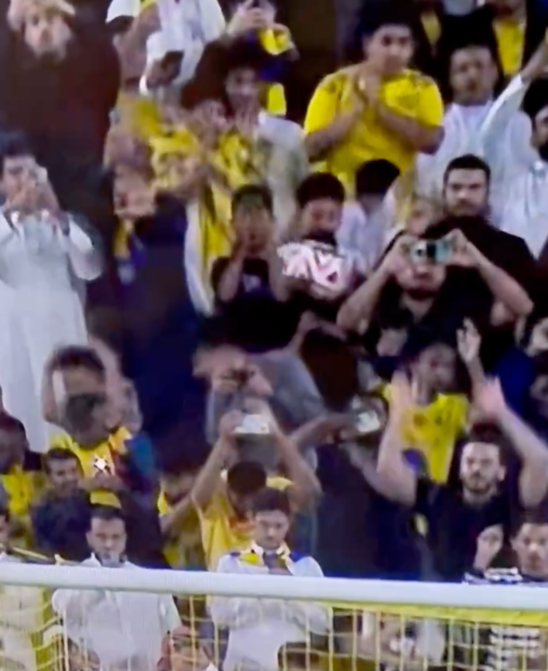 The wayward spot-kick slammed into a filming fan in the crowd