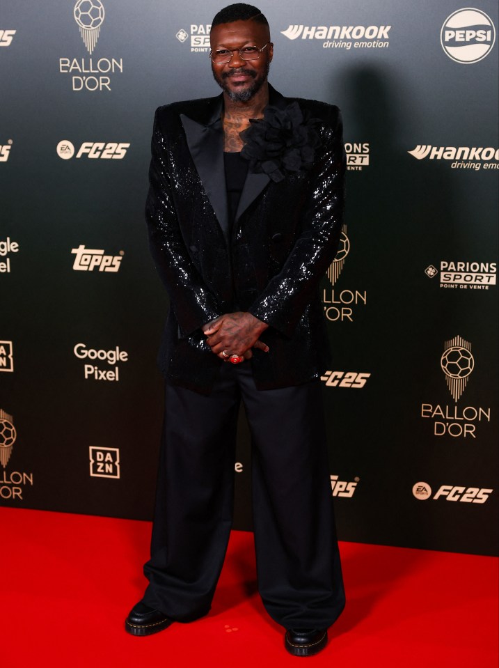 Former Liverpool striker Djibril Cisse was in attendance in an eye-catching blazer