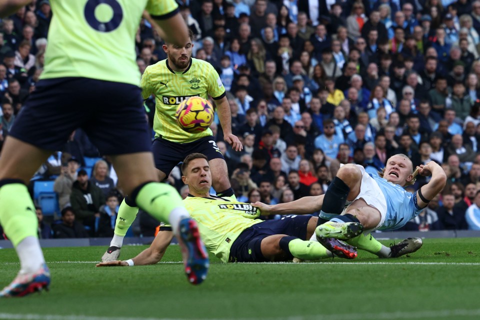 The striker found the net despite being dragged to the floor