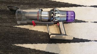 Dyson V11 vacuum with bin open
