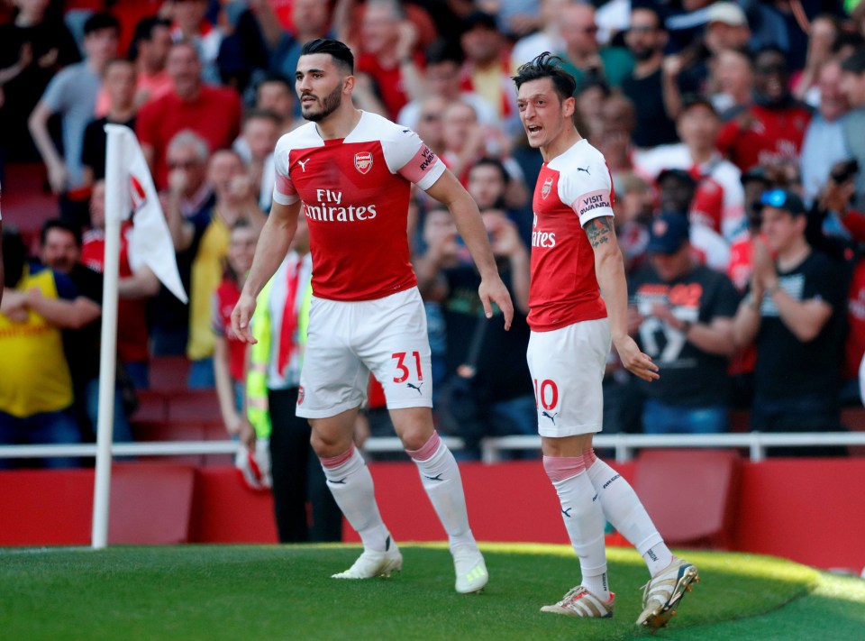Sead Kolasinac, left, and Mesut Ozil in action for Arsenal in 2019