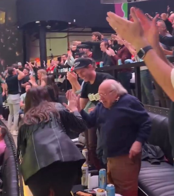DeVito high-fives another fan