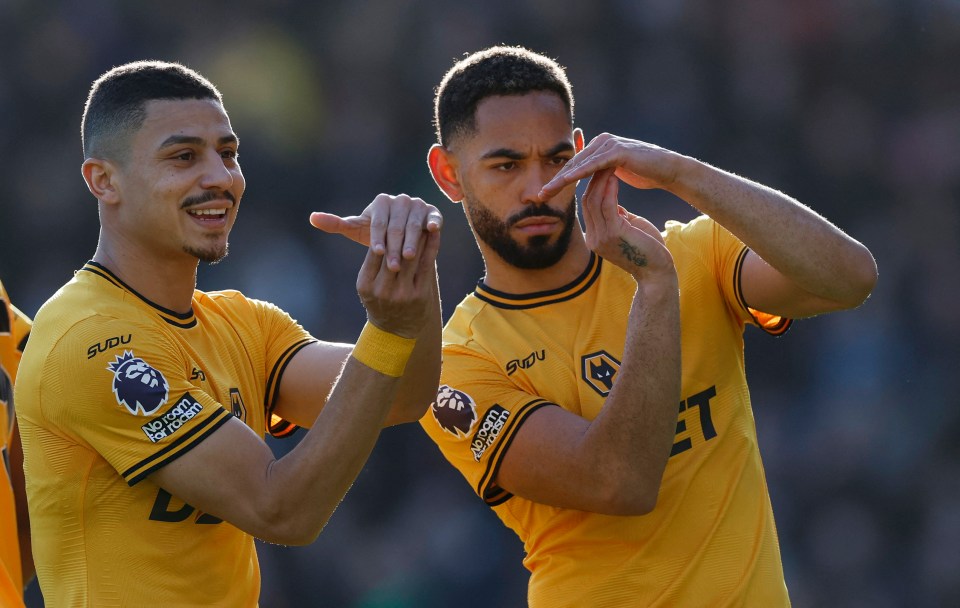 Wolverhampton Wanderers players Matheus Cunha and Andre celebrating a goal.