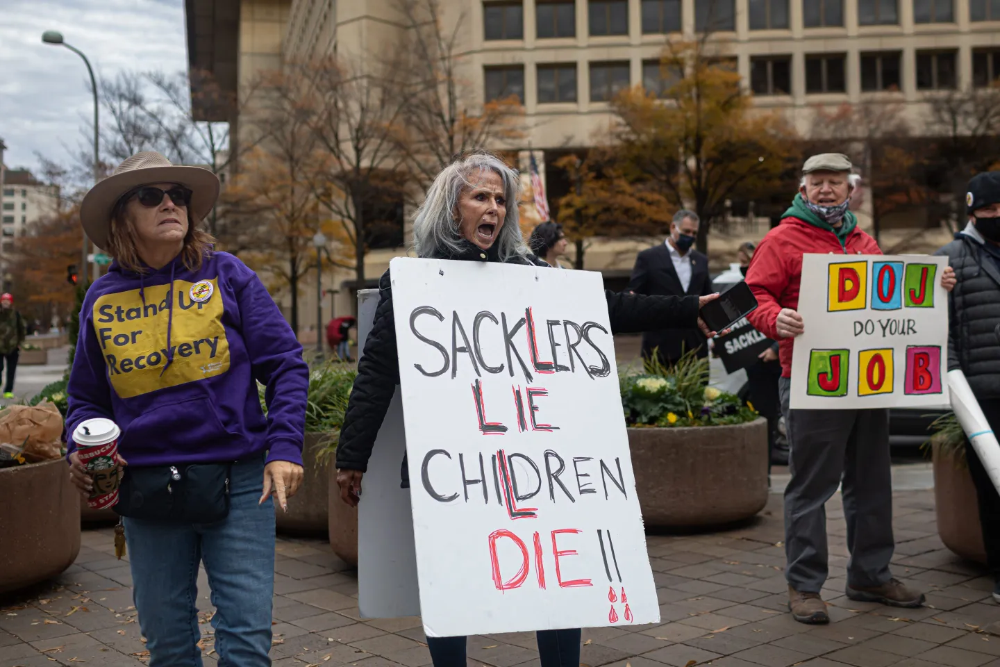 People from across the U.S., who lost loved ones due to the opioid epidemic, rallied at the Department of Justice in Washington D.C, calling for criminal charges against members of the Sackler family, on Dec. 3, 2021.. 