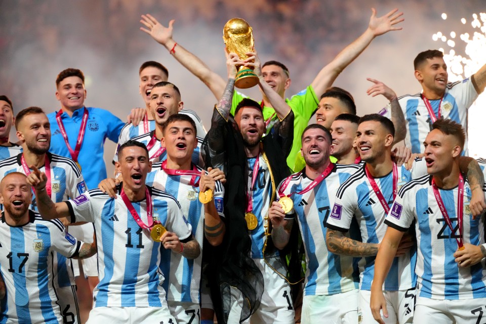 Argentina's soccer team celebrates winning the World Cup trophy.