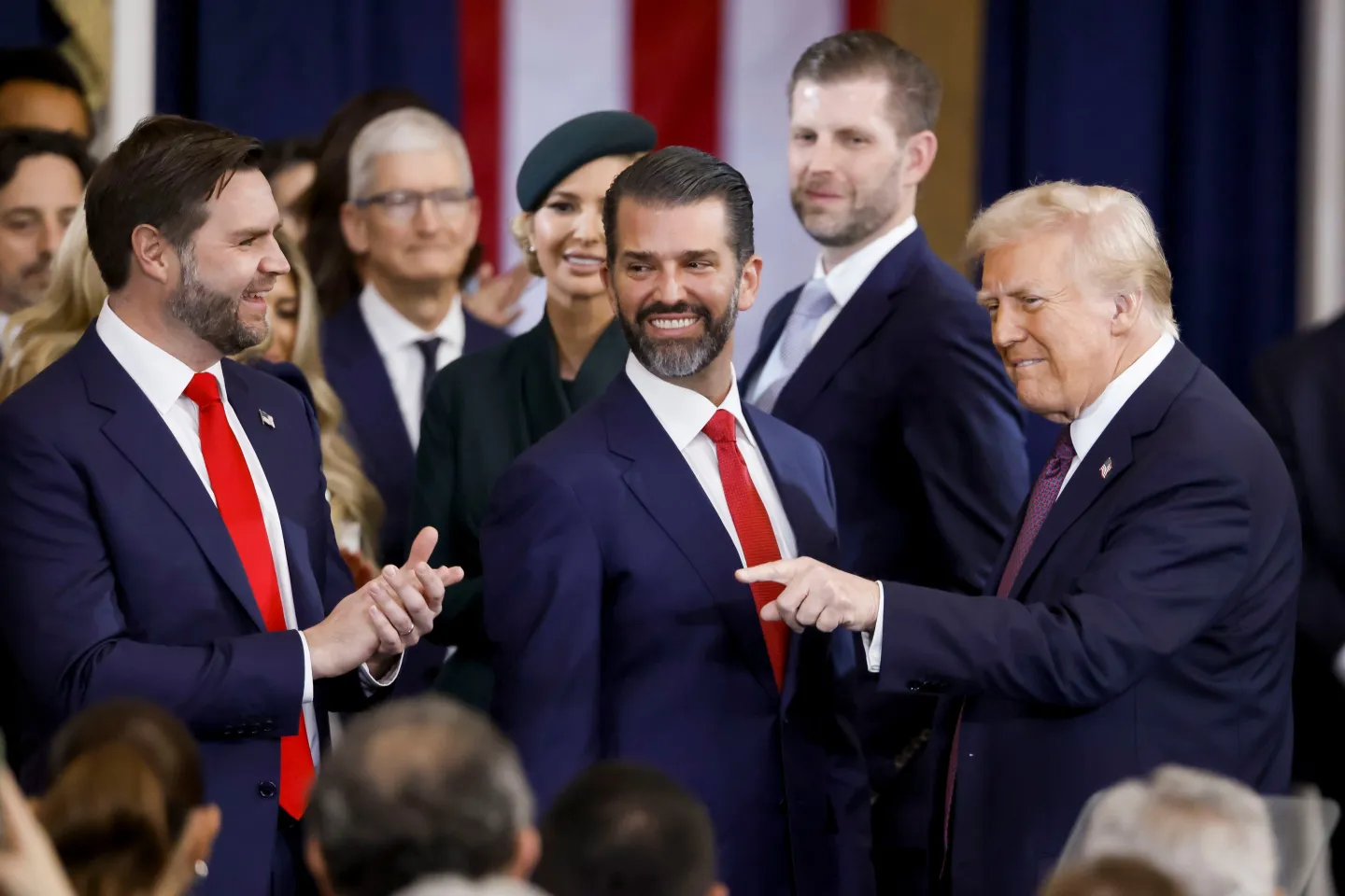 Donald Trump Jr. with his father on one side and JD Vance on the other
